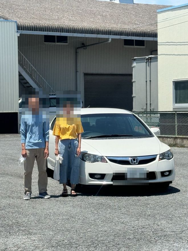 Delivered Honda Civic — face and plate blurred for privacy
