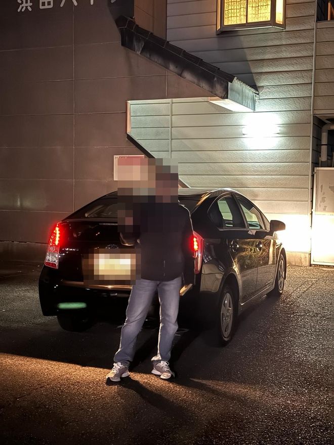 Delivered Toyota Prius — face and plate blurred for privacy