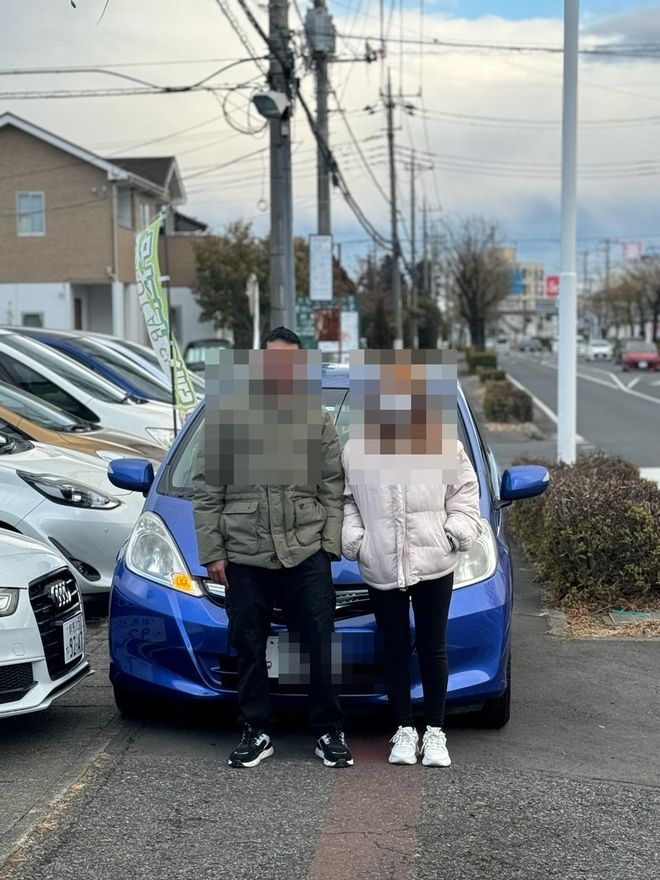 Delivered Compact car — face and plate blurred for privacy
