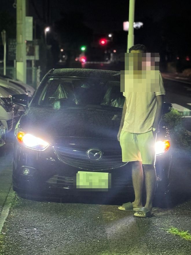 Delivered Mazda sedan — face and plate blurred for privacy