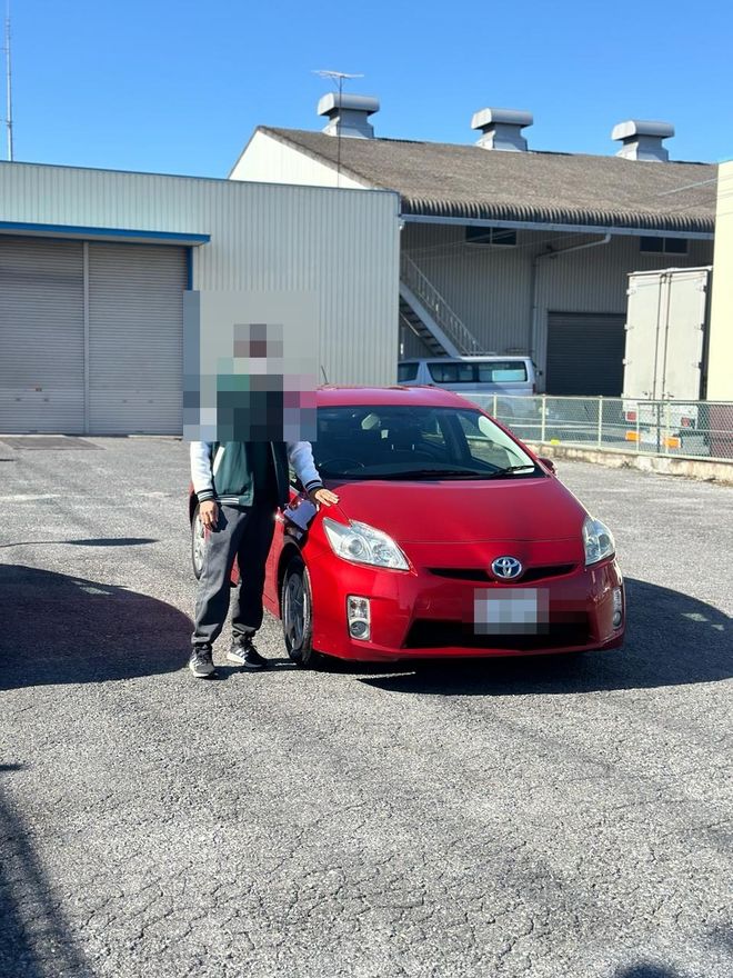 Delivered Toyota Prius — face and plate blurred for privacy